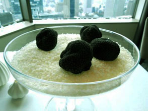 winter black truffles on rice grains in a glass tray